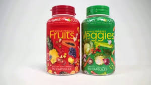 Two dietary supplement bottles labeled 'Fruits' and 'Veggies' with colorful graphics on a white background.